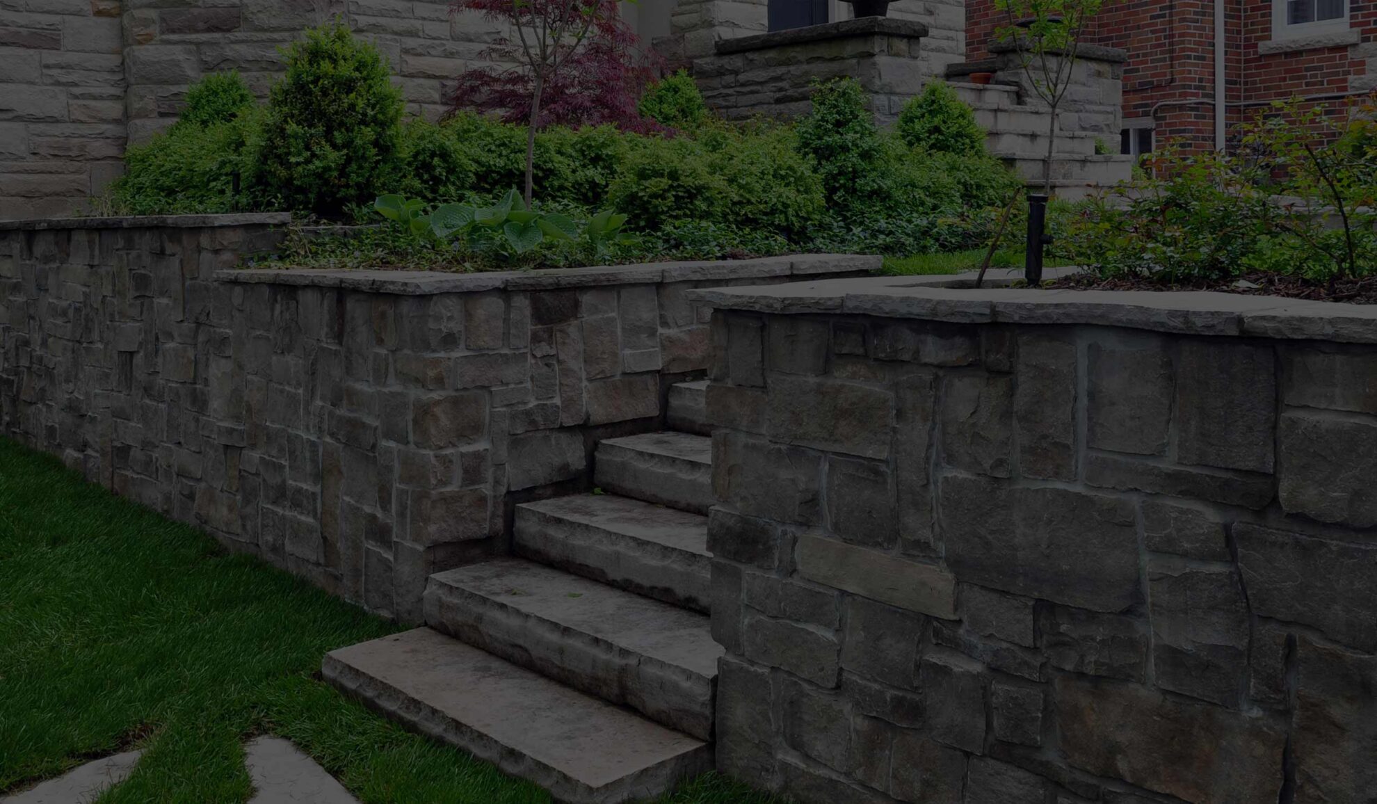 natural stone retaining wall with steps included at house garden overland park ks